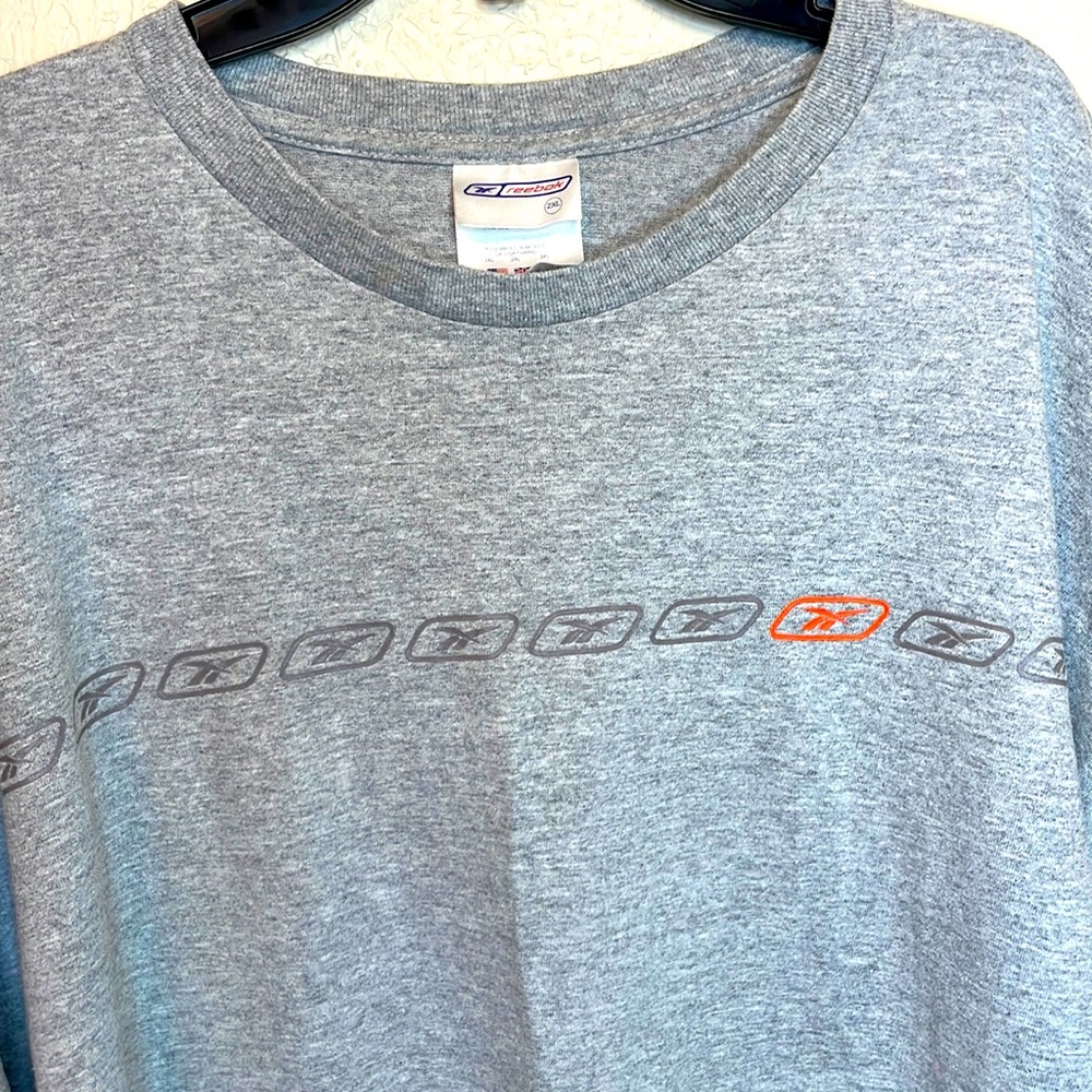 Reebok Mens Gray T-shirt With a Small Band of Brand Logos Across the Chest